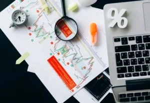 Professional pointing at Forex charts.